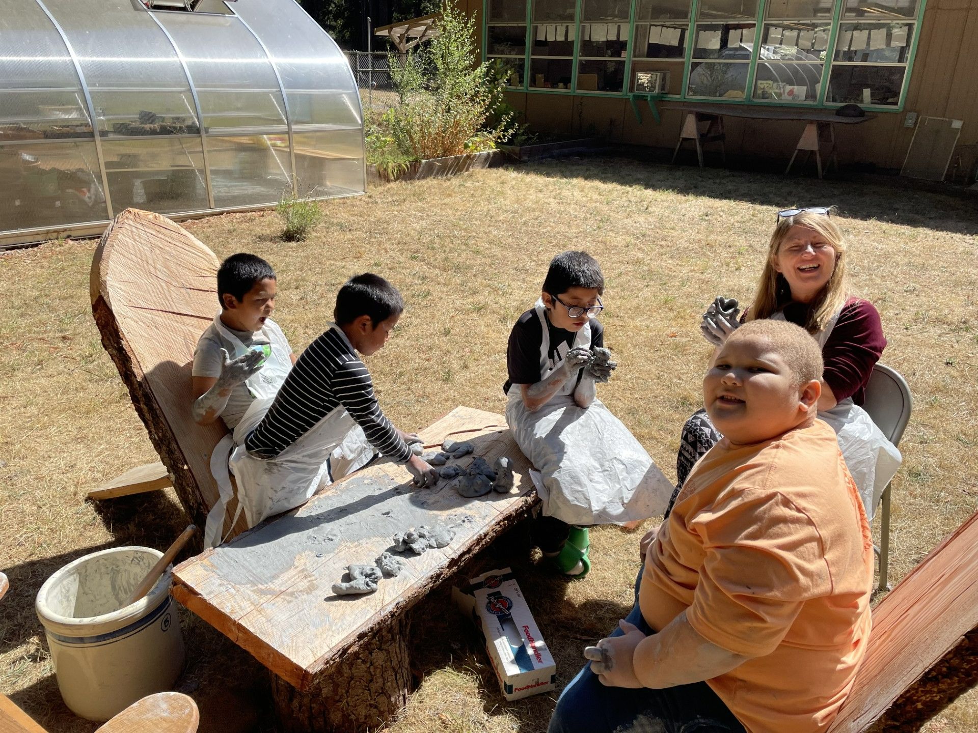 Students working with clay