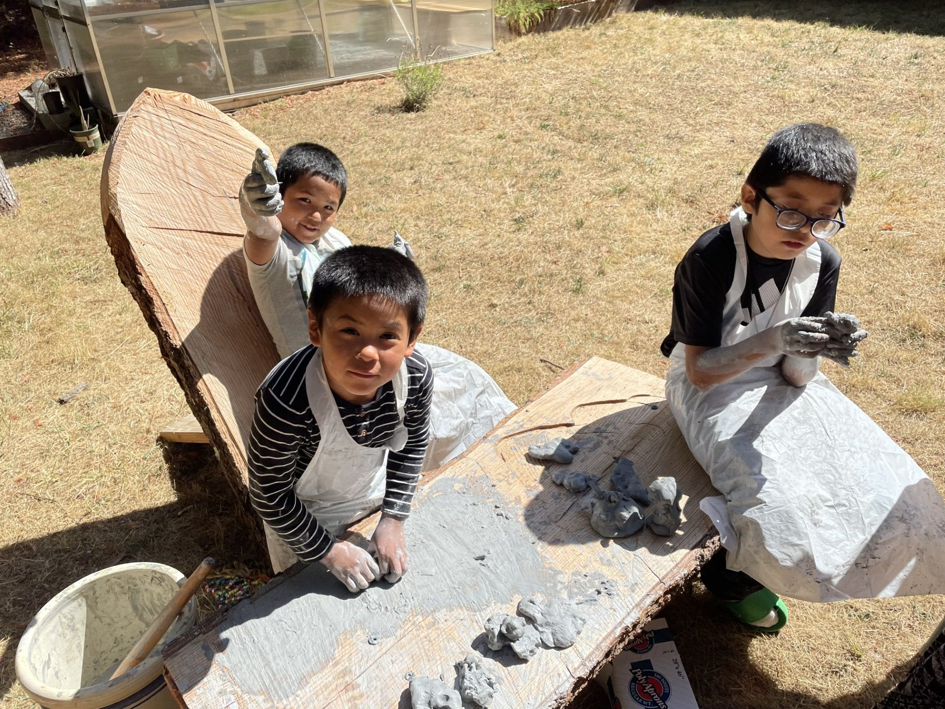 Students working with clay